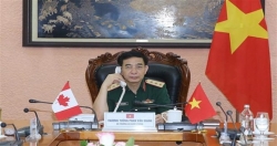 Вьетнам укрепляет оборонное сотрудничество с Лаосом и Канадой